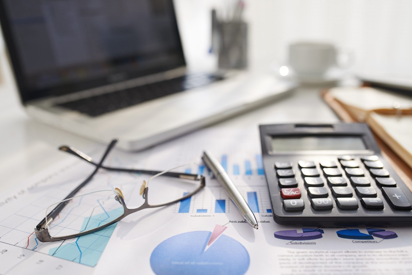 office scene with financial charts calculator and 2026 01 07 06 58 36 utc scaled